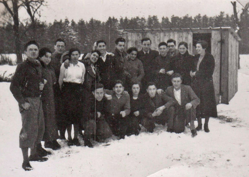 Group with Kurt Wohl in front of the sheds. January 7, 1937.